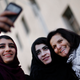 Manar Daghash, from left, and Sundous Daghash pose for a selfie with Rasmea Odeh after leaving federal court in Detroit Thursday, March 12, 2015. Image via AP.